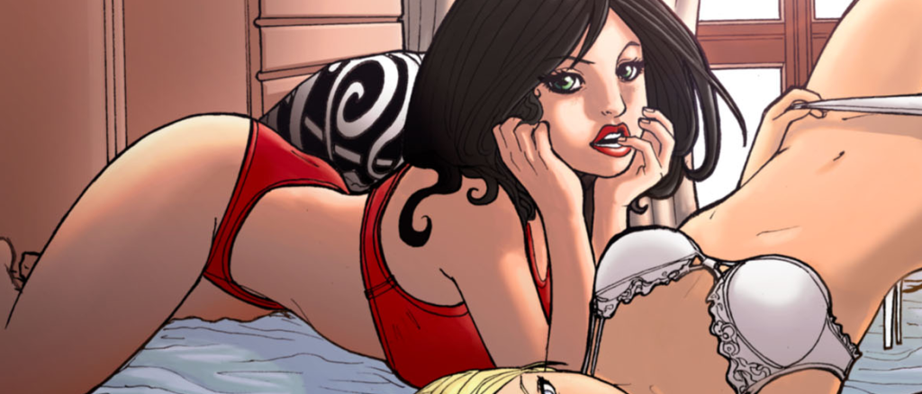 Two adults in lingerie on a bed; a brunette in red underwear props on her elbows and gazes toward the viewer while another woman in a white bra lies nearby.